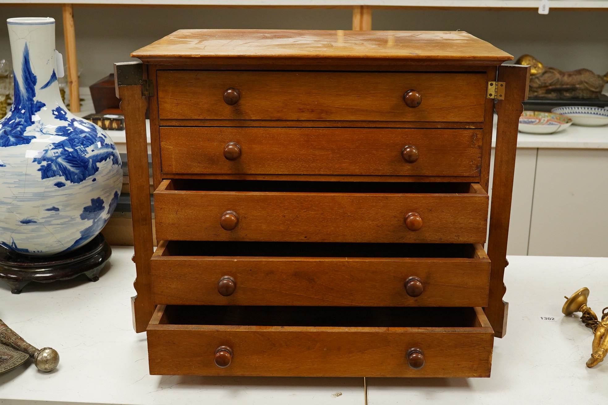 A small mahogany specimen Wellington chest with five drawers, 48cm high. Condition - fair